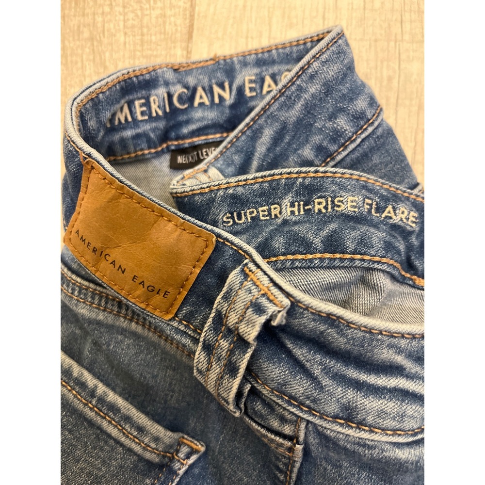 American Eagle Super Hi-Rise Flare Jeans Medium Wash Patch Pocket Womens 8